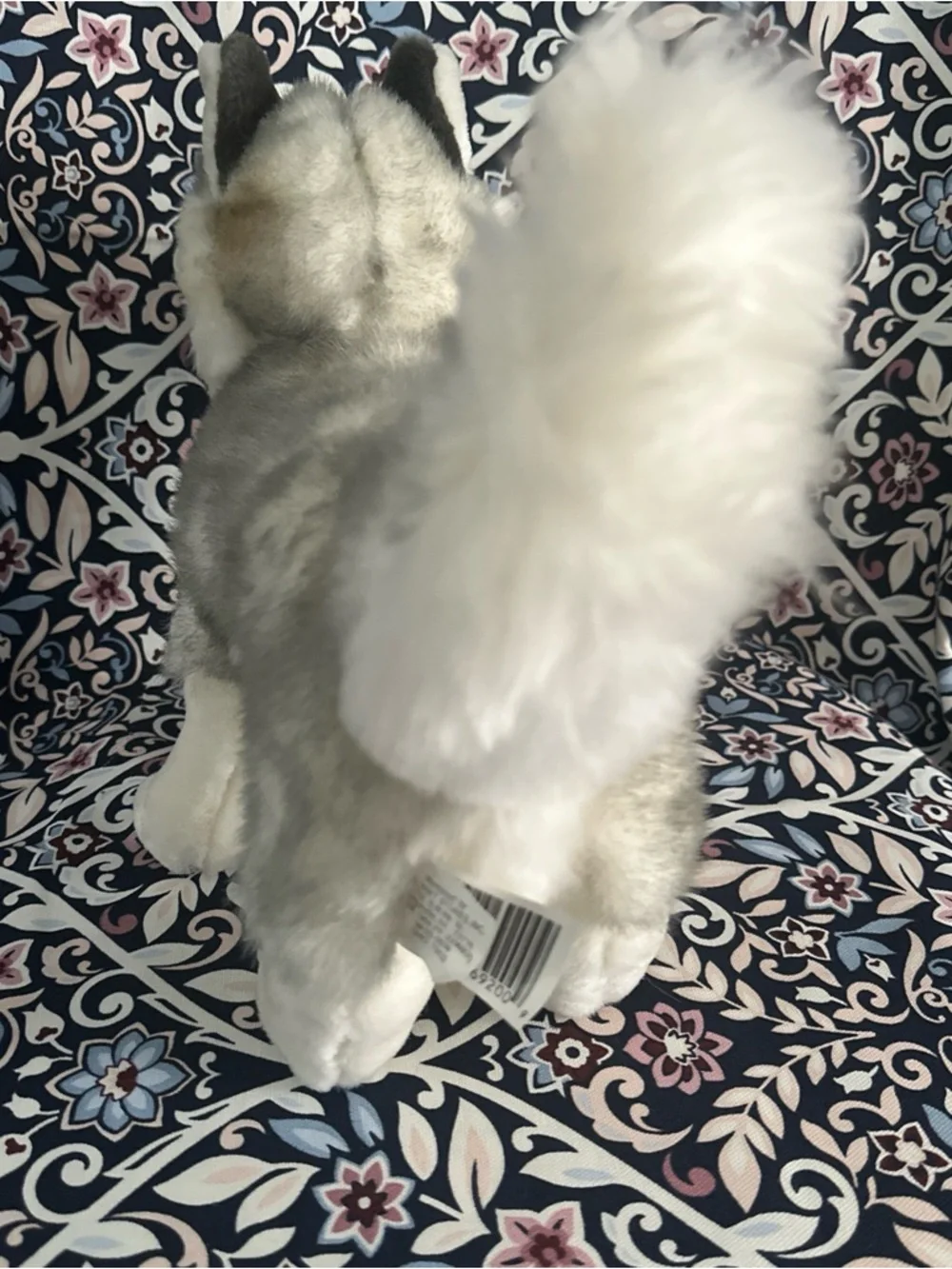 Siberian Husky dog toy with blue eyes and a happy open mouth showing its tongue